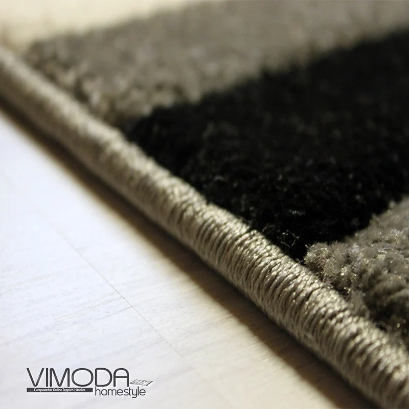 Designer Teppich Geschwungene Linien Grau, Weiß und Schwarz Harmonisch