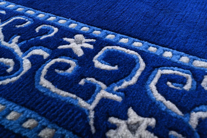 Handgeknüpfter tibetischer Teppich in blau mit Retro-Bordüre – Neuwertig